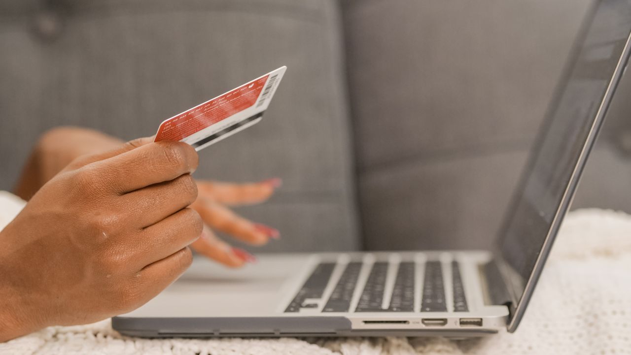 Customer paying by card on a laptop