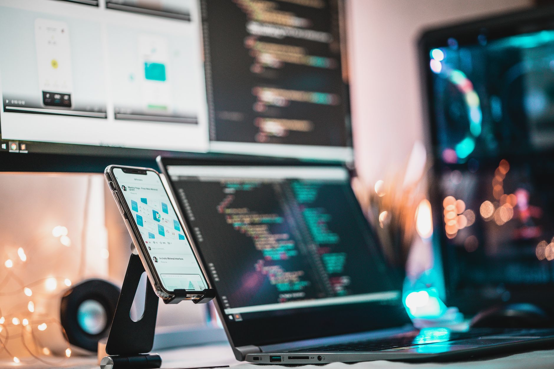 Mobile development workspace with code on screen